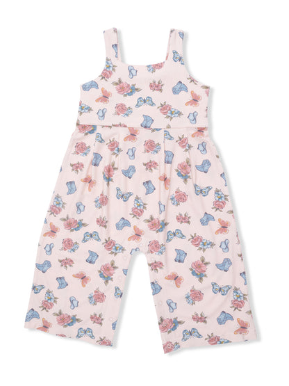 Pale pink jumpsuit with floral and butterfly patterns, featuring adjustable straps and a relaxed fit.