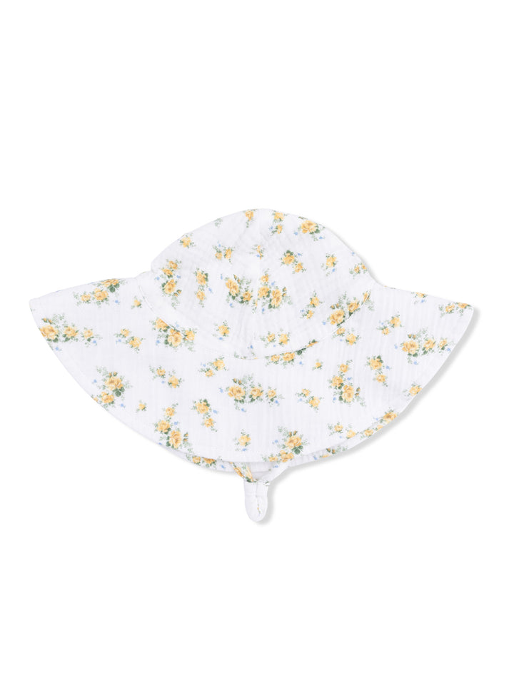 Floral white sun hat with yellow flowers, wide brim, and chin strap. Perfect for sunny days outdoors.