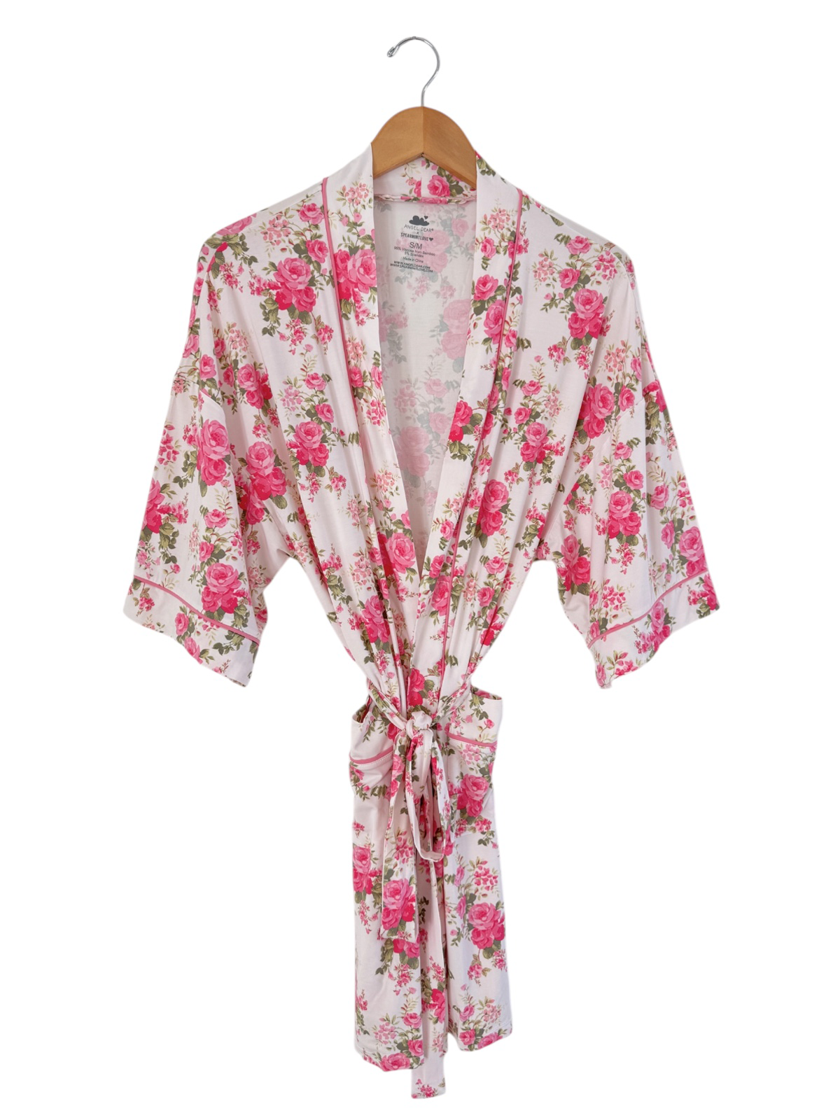 Floral women's robe with pink roses, displayed on a wooden hanger, featuring a tie waist and short sleeves.