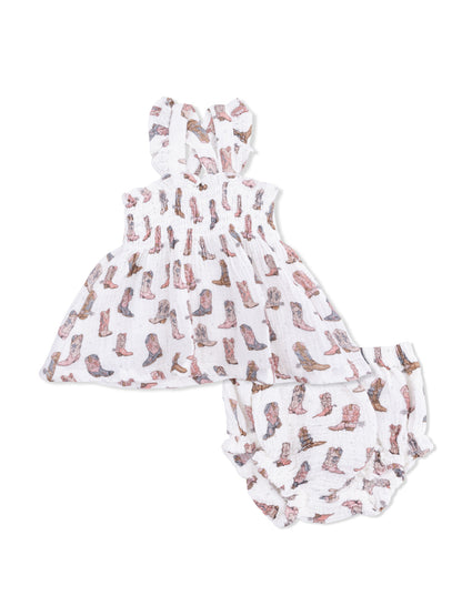 Children's two-piece outfit featuring a dress and matching bloomers with a cowboy boot print on a white background.