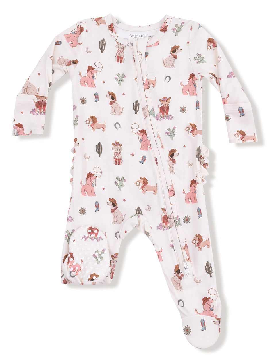 Children's pajama onesie with playful dog and cowboy prints, featuring a front zipper and long sleeves.