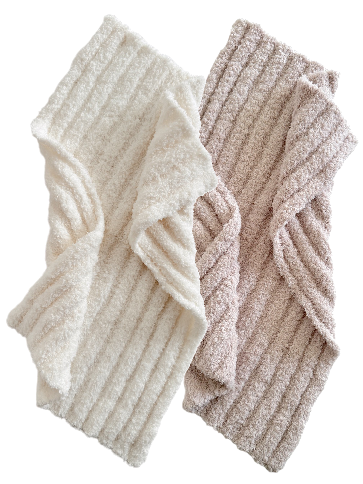 Two soft, textured fabric blankets in white and light pink, folded in a zigzag pattern.
