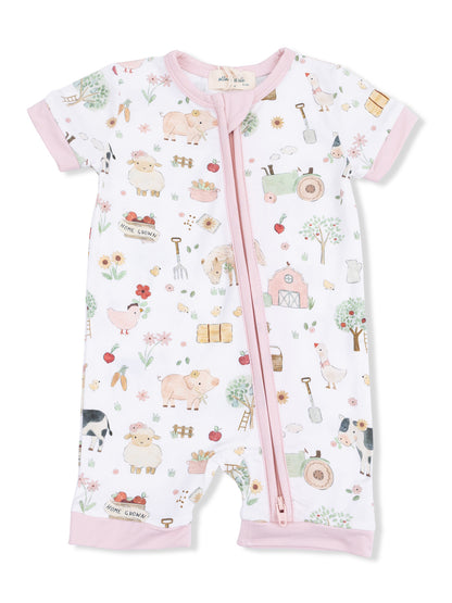 Child's short-sleeve romper featuring a whimsical farm-themed print with animals, plants, and farm equipment.