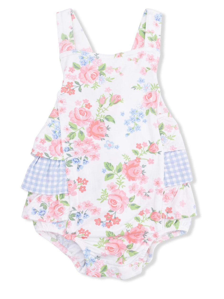 Floral baby romper with pink roses and blue accents, featuring ruffled layers and shoulder straps. 