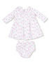 White dress with floral print and matching bloomer, featuring long sleeves and a collar. Perfect for baby girls.