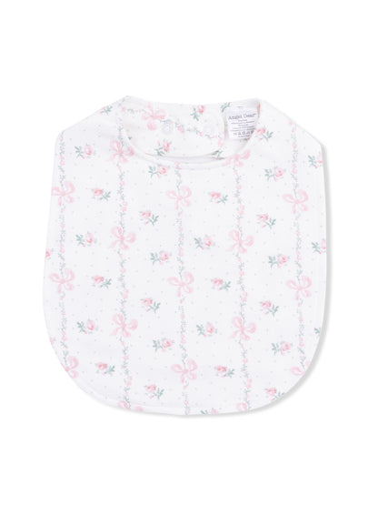 Floral baby bib with pink bows and green vines on a white background.