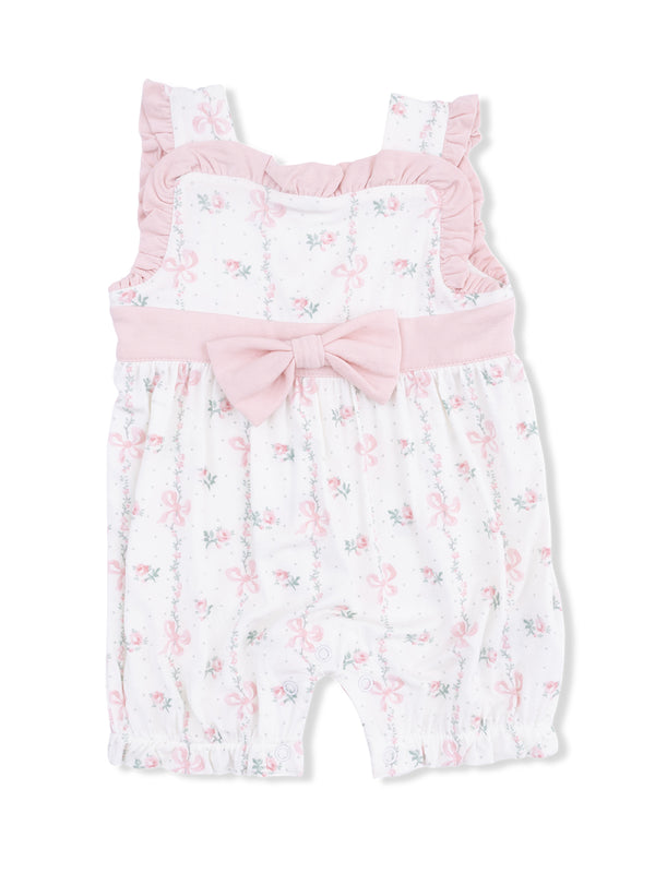 Pink floral romper with ruffled straps and a large bow, perfect for toddlers or infants.