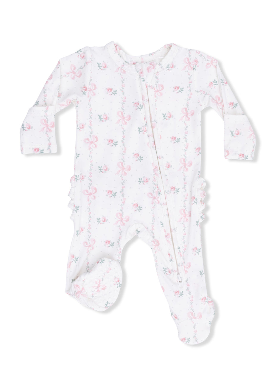 White baby onesie with pink bows and floral print, featuring long sleeves and footed design.