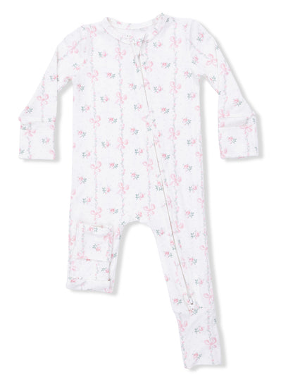 White infant pajamas with pink floral and bow pattern, featuring a front zipper and long sleeves.