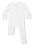 White infant pajamas with pink floral and bow pattern, featuring a front zipper and long sleeves.