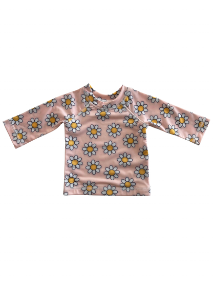 Pink long-sleeve shirt with a daisy pattern, ideal for children's spring or summer wear.