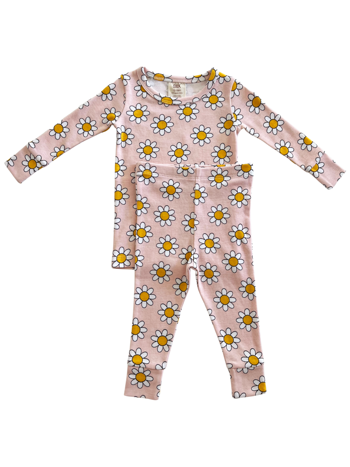 Pink pajamas with long sleeves and floral daisy pattern, featuring yellow centers and white petals.