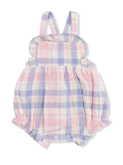Lightly checked pink and blue baby romper with ruffled shoulders and snap closures at the bottom.