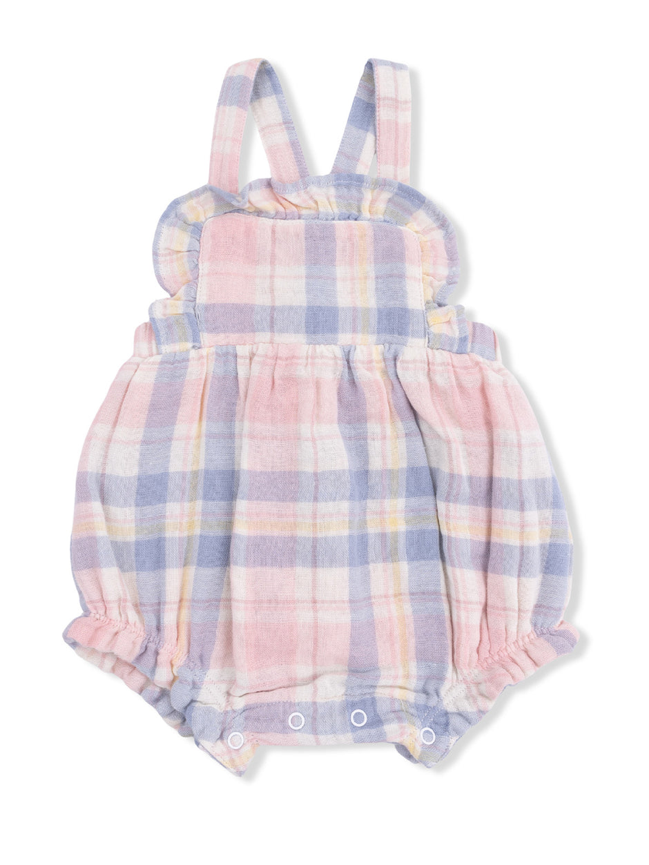 Lightly checked pink and blue baby romper with ruffled shoulders and snap closures at the bottom.
