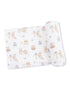 Patterned fabric with cute cartoon animals, including rabbits and chicks, in a playful spring design.