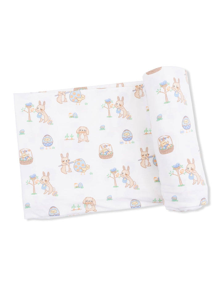 Patterned fabric with cute cartoon animals, including rabbits and chicks, in a playful spring design.