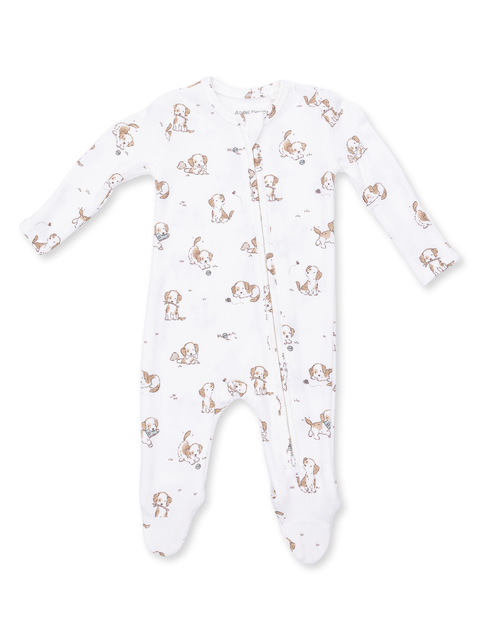 Infant onesie with playful puppy print on a white background, featuring long sleeves and a front zipper.