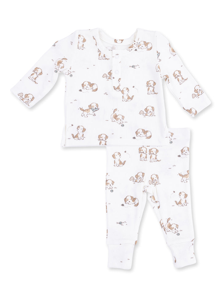 White baby pajama set featuring playful puppy prints on a long-sleeve top and pants.