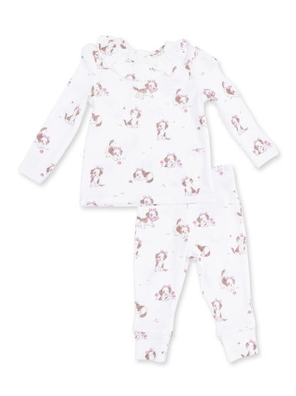 White baby pajamas featuring playful puppy patterns, including a long-sleeve top and matching pants.