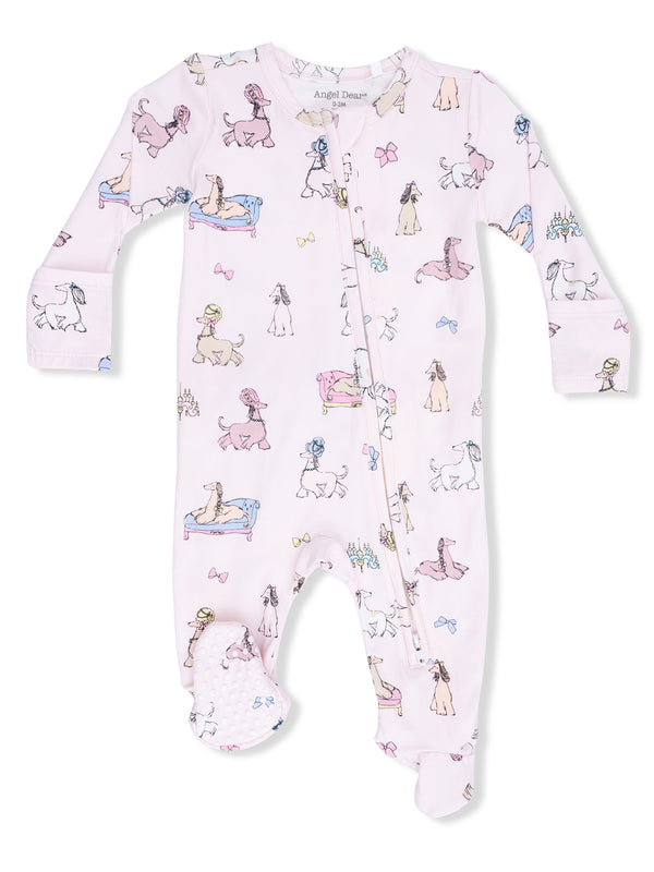 Pink baby onesie with playful dog illustrations and bows, featuring a front zipper and footed design.
