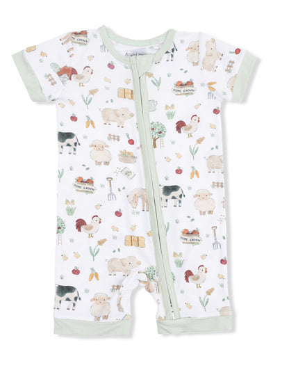 Children's romper featuring farm animal prints, including sheep, cows, and roosters, with a zip closure.
