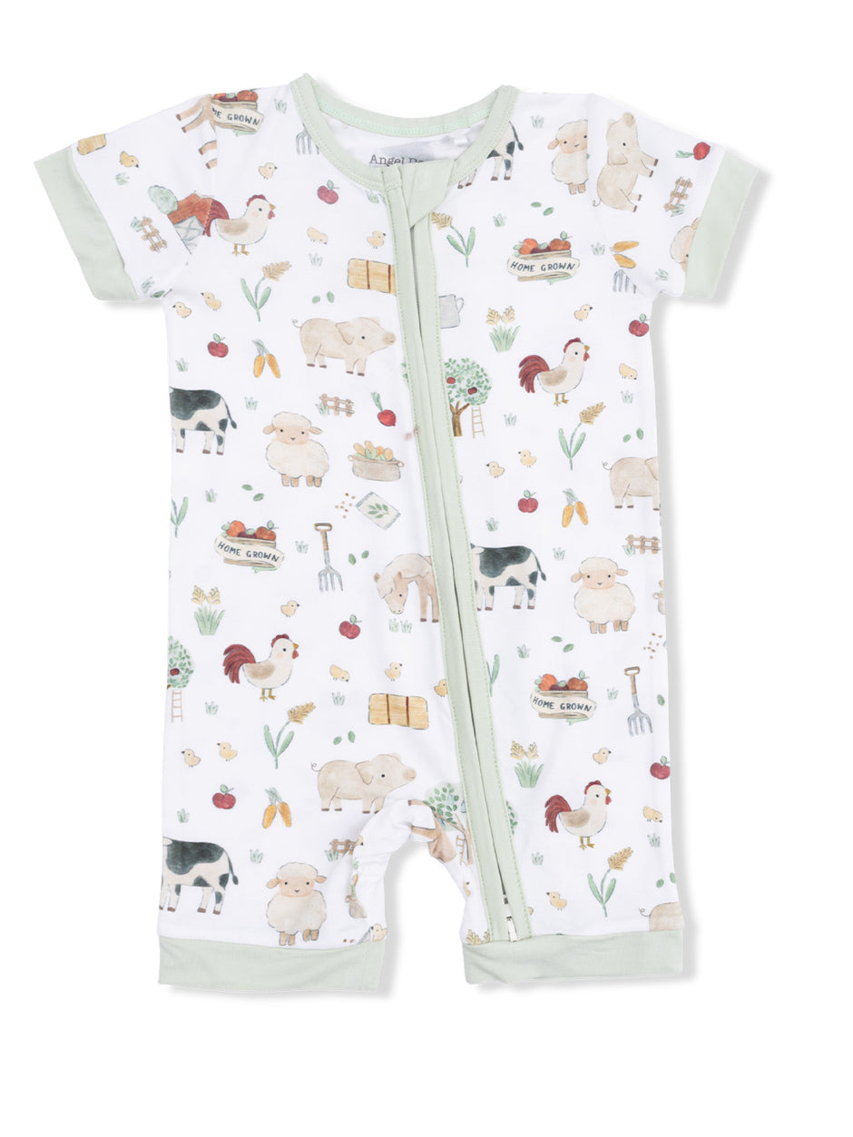 Children's romper featuring farm animal prints, including sheep, cows, and roosters, with a zip closure.