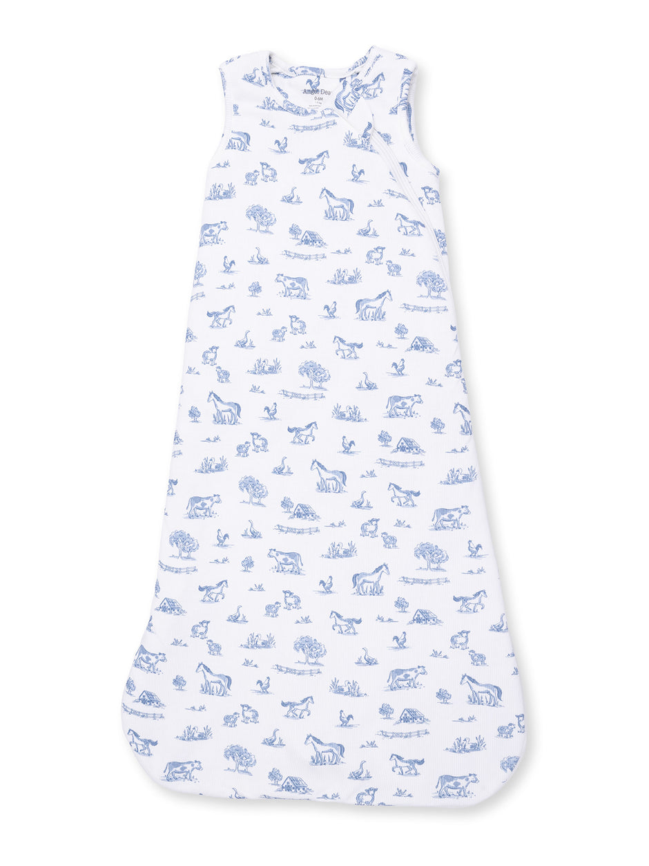 Children's sleep sack featuring blue animal and nature patterns on a white background. Ideal for cozy bedtime.