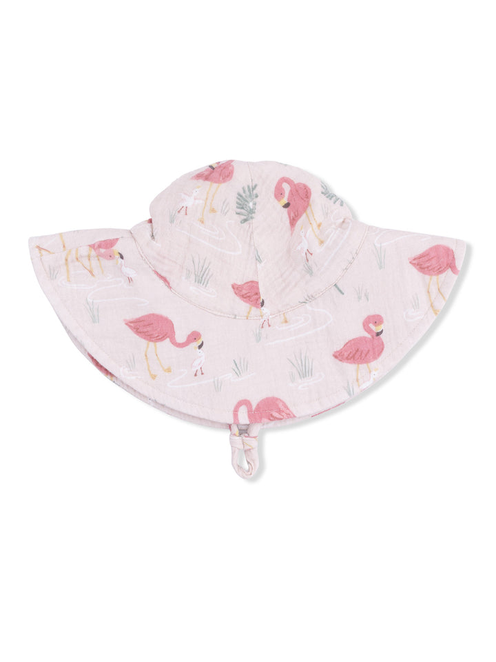 Pink sun hat with flamingo patterns, featuring a wide brim and a chin strap for secure fit.