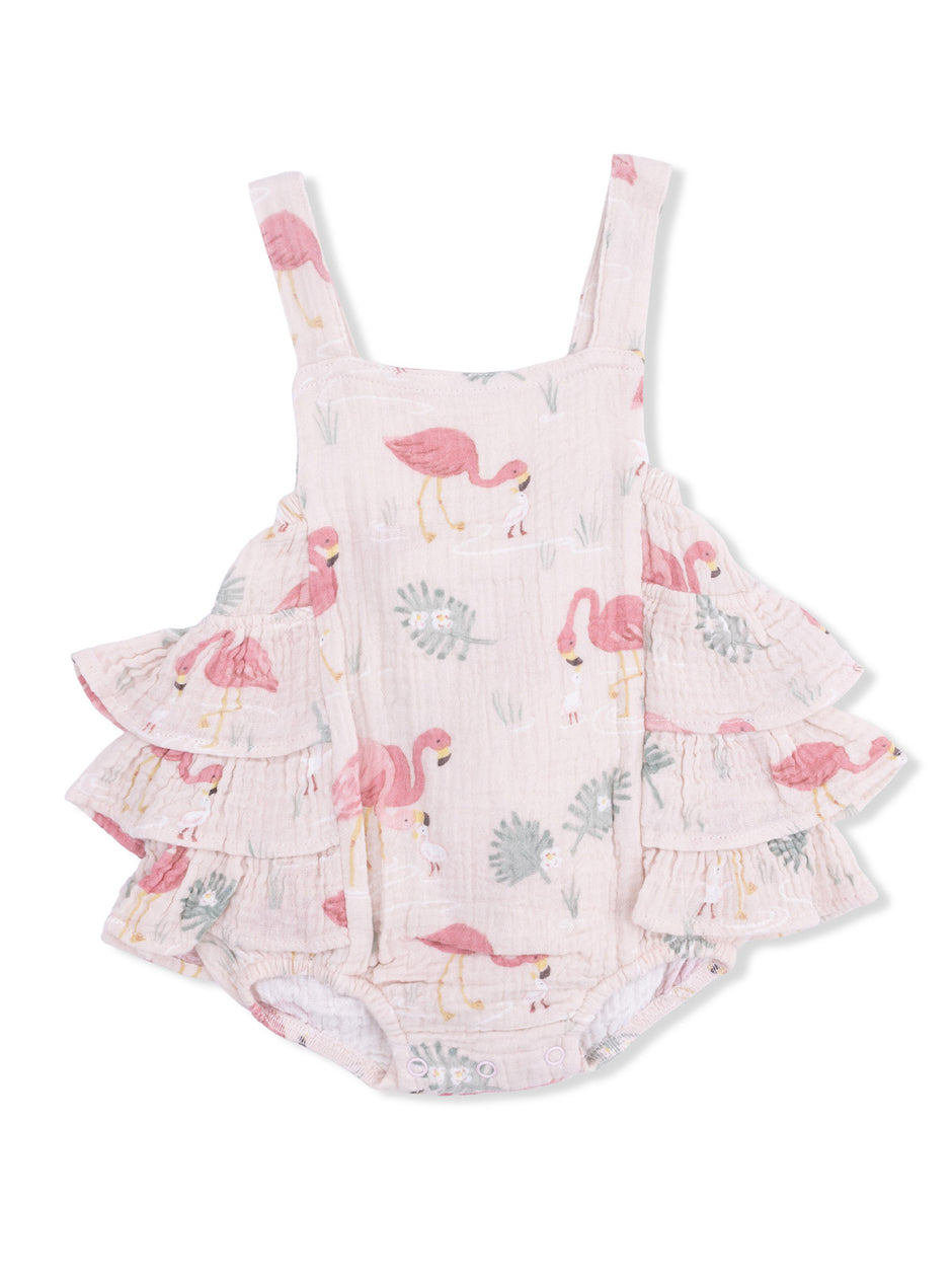 Flamingo-patterned baby romper with ruffle accents and adjustable straps. Ideal for warm weather outfits.