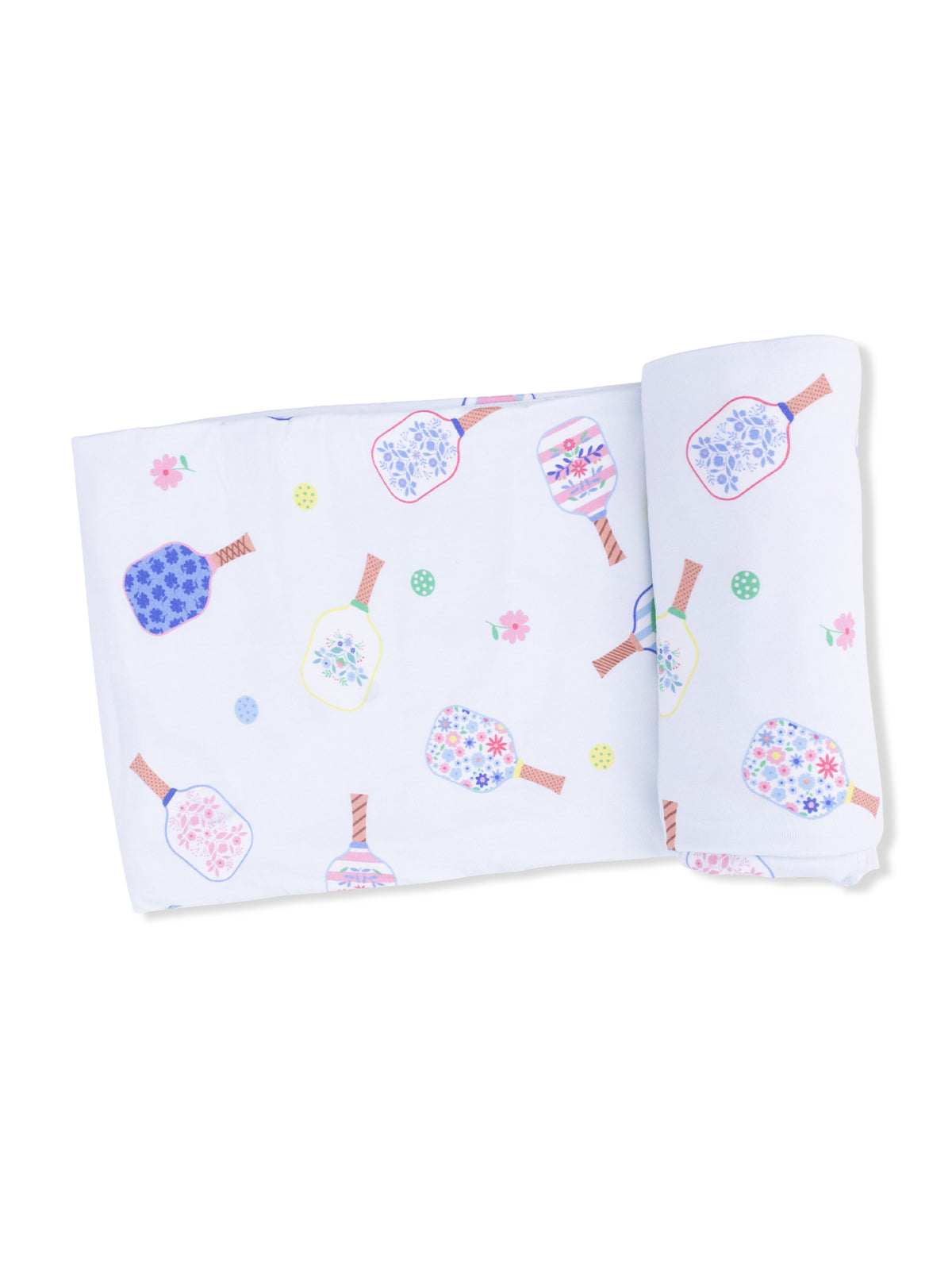 White fabric with colorful floral patterns and designs resembling decorative bottles, rolled on one side.