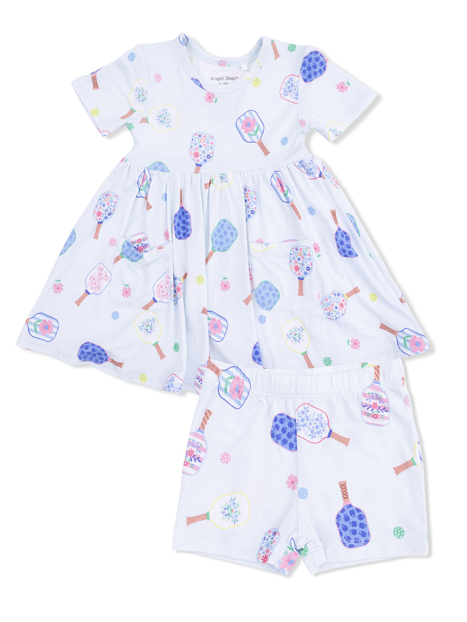 White dress with short sleeves and colorful popsicle patterns, paired with matching shorts. Ideal for summer wear.