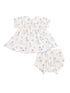White baby dress with floral and animal prints, featuring a collar and matching bloomers.