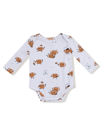 Brown cartoon footballs with faces and colorful accessories on a white onesie. Long sleeves and snap closures.
