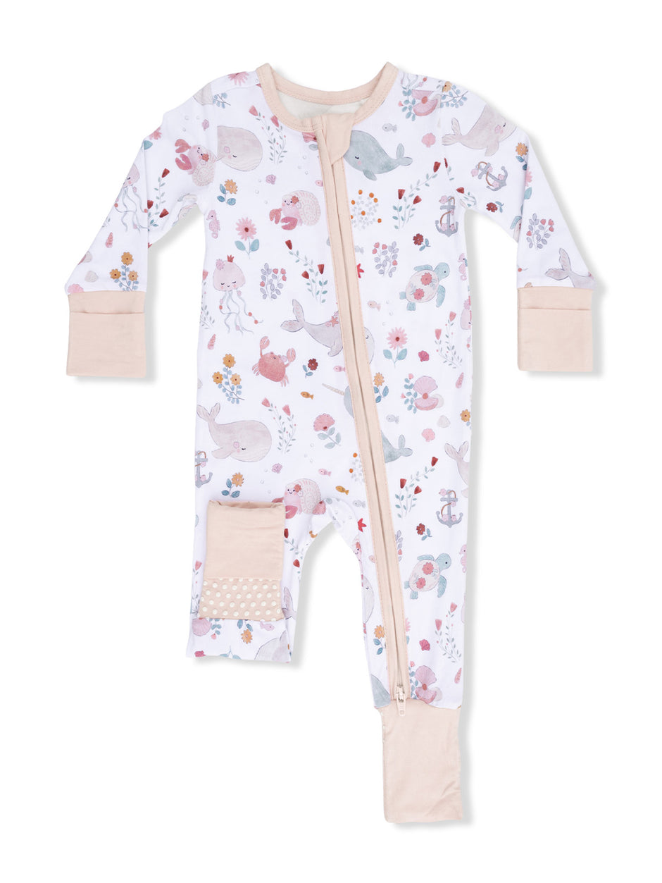 Children's zip-up pajama in pastel colors featuring playful animal and floral patterns. Ideal for comfort and style.