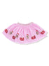 Pink tulle skirt adorned with sequin hearts and gingerbread decorations. Perfect for festive occasions.