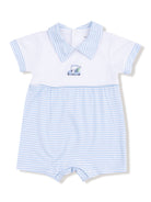 Blue and white striped baby romper with a golf cart embroidery on the front.