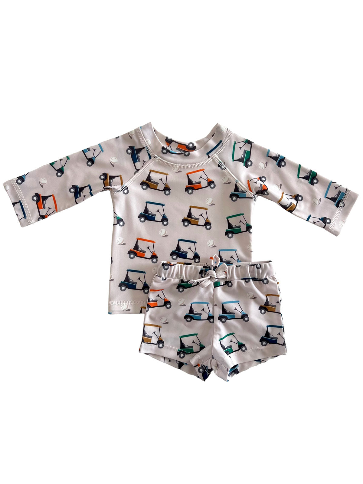 Golf cart patterned kids' swimwear set featuring a long-sleeve top and matching shorts.
