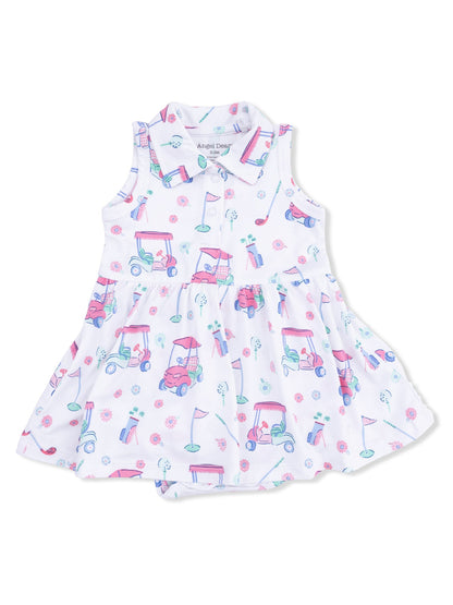 White dress with colorful golf cart and floral print, featuring a collar and a flared skirt design.
