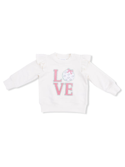 White sweatshirt with ruffle sleeves featuring the word "LOVE" and a decorative polka dot design.