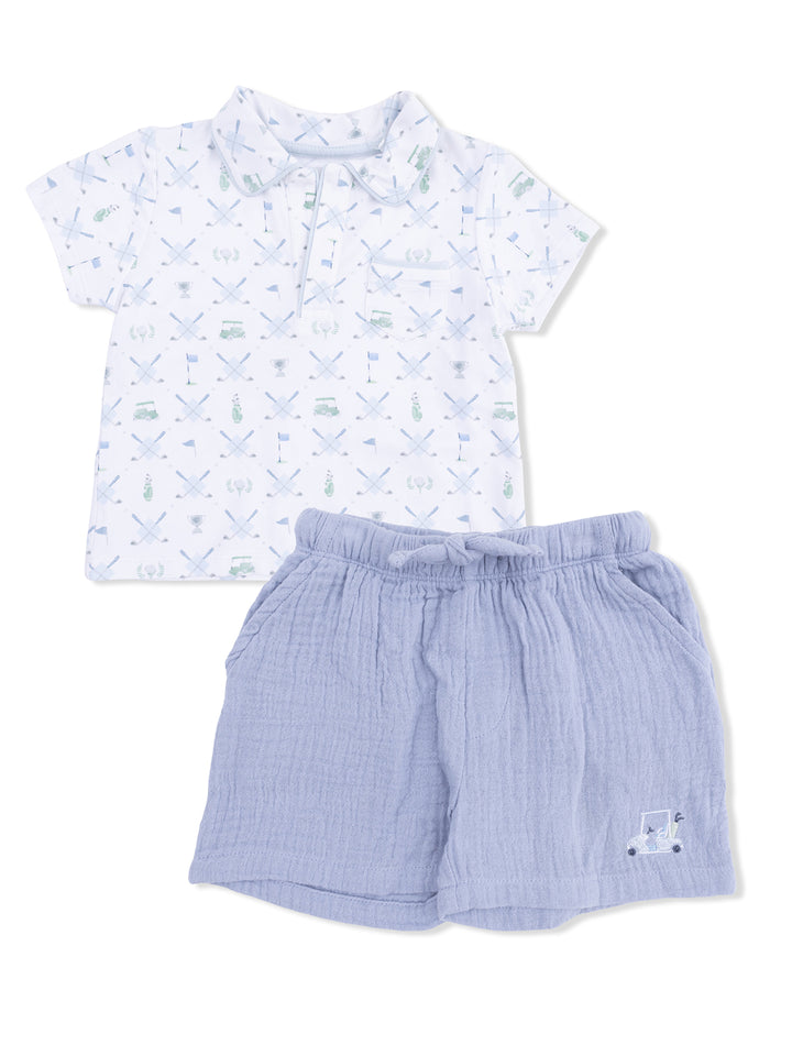 Boys' outfit featuring a patterned polo shirt and light blue shorts with a playful truck design.