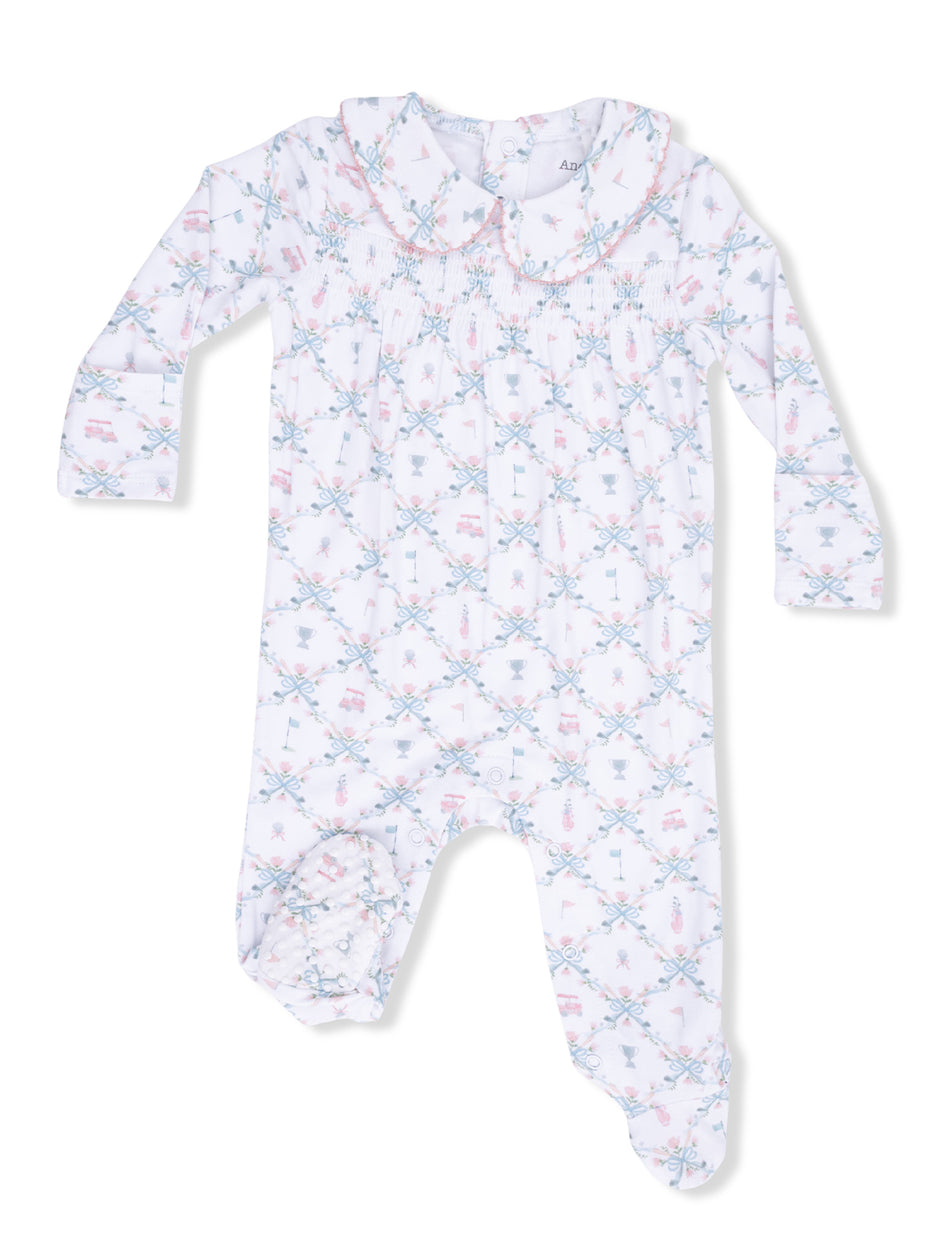 White baby onesie with a decorative pattern and a collared neckline. Perfect for infant wear.