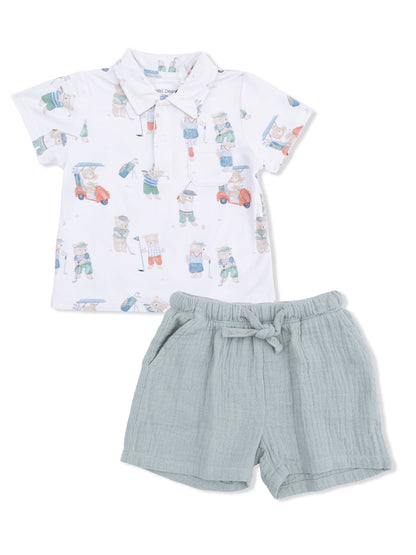 Children's golf-themed polo shirt with shorts, featuring playful bear illustrations in soft colors.