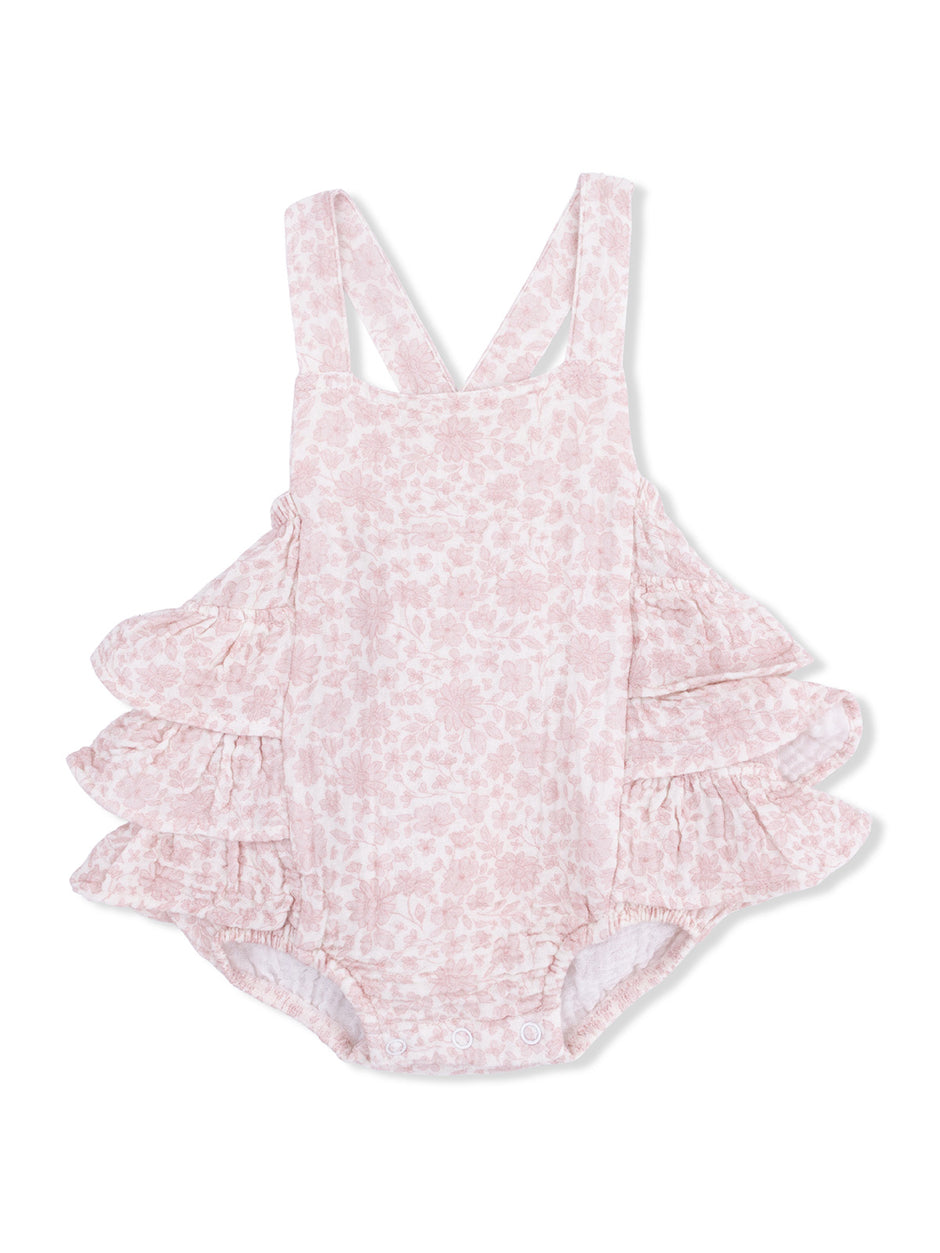 Floral infant romper in light pink with ruffled sleeves and snap closure at the bottom. Perfect for warm weather.