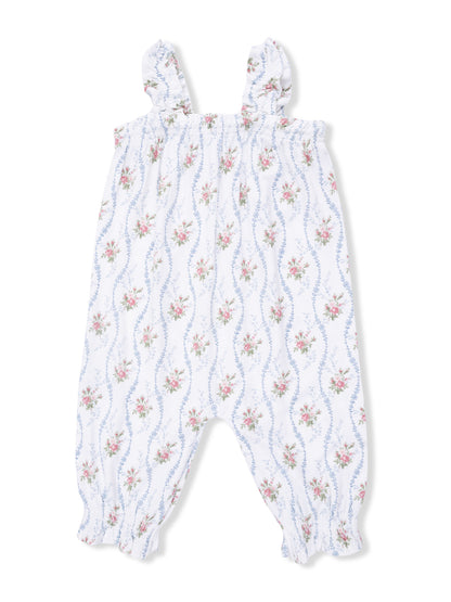 White floral romper with ruffled straps and elastic cuffs, featuring pink and blue flower patterns.