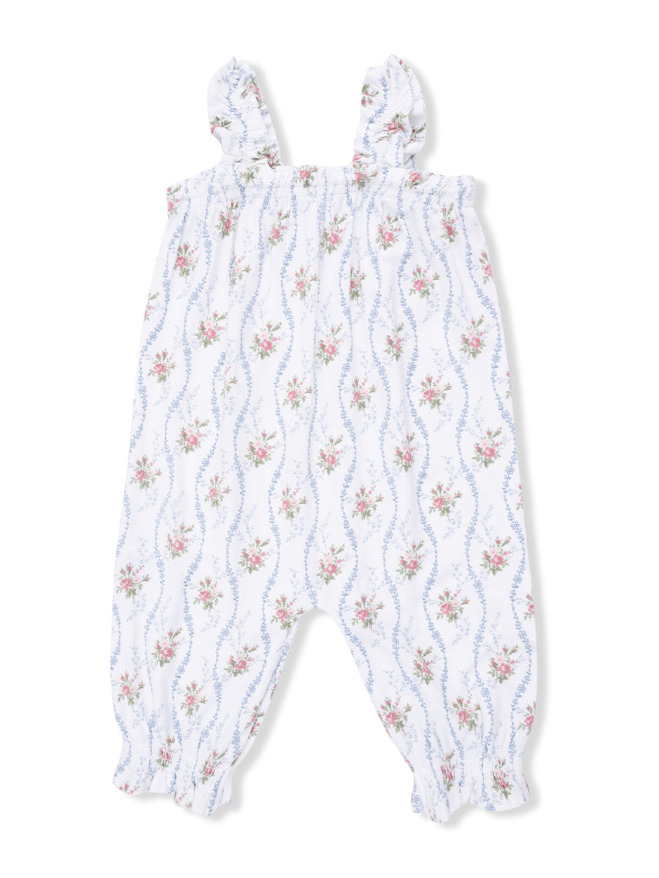 White floral romper with ruffled straps and elastic cuffs, featuring pink and blue flower patterns.