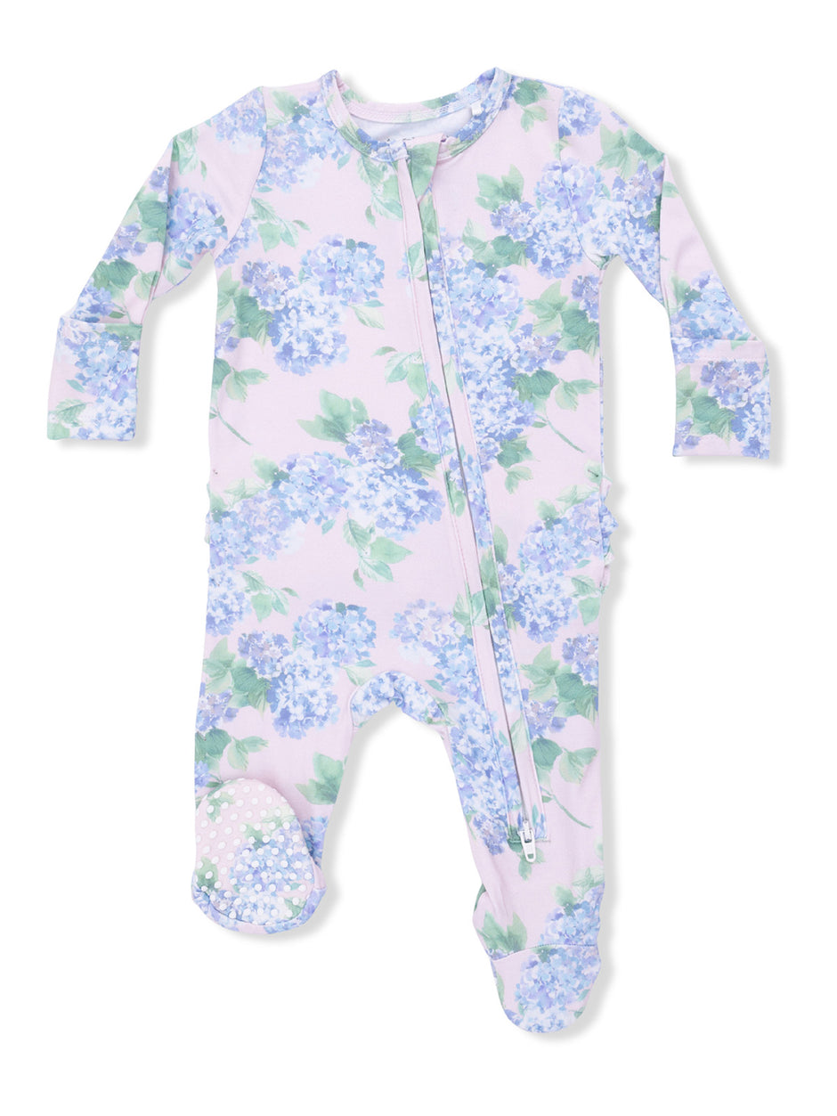Floral print baby onesie in light purple with a front zipper and footed design, featuring blue hydrangea flowers.