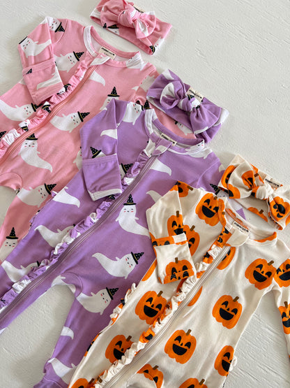Assorted children's rompers and headbands with ghost and pumpkin designs, perfect for Halloween.