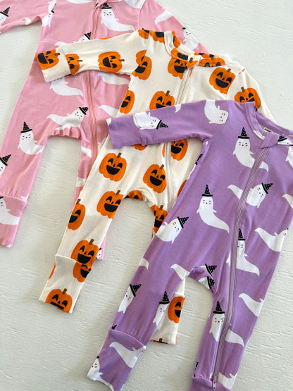 Three colorful toddler onesies featuring ghosts and pumpkins, perfect for Halloween festivities.