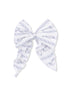 White bow with blue floral patterns and striped design, perfect for hair accessories or decorative uses.