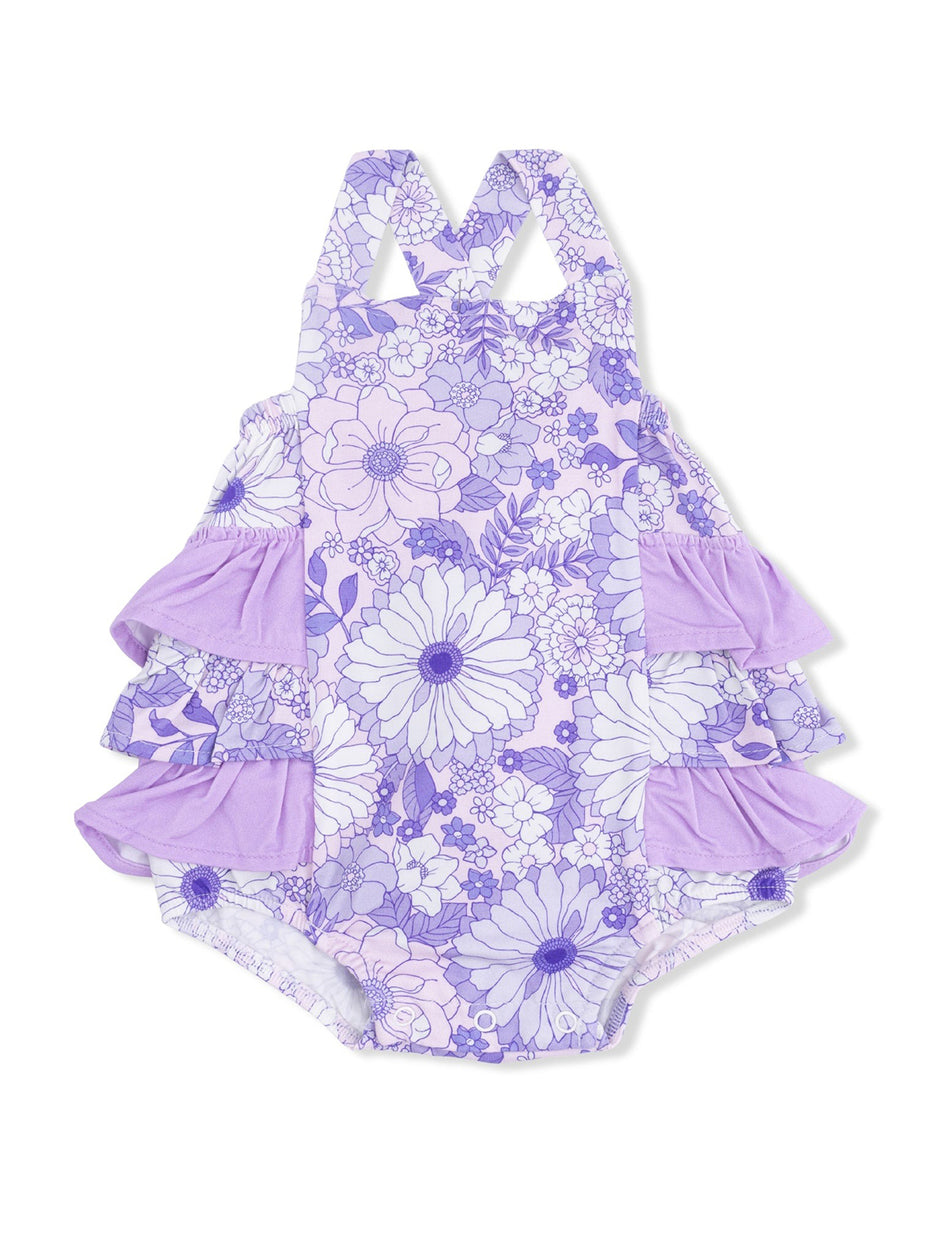 Purple floral ruffled swimsuit with cross-back straps and layered accents for girls.